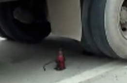 Why does a hydraulic jack suddenly slip off when lifting a car